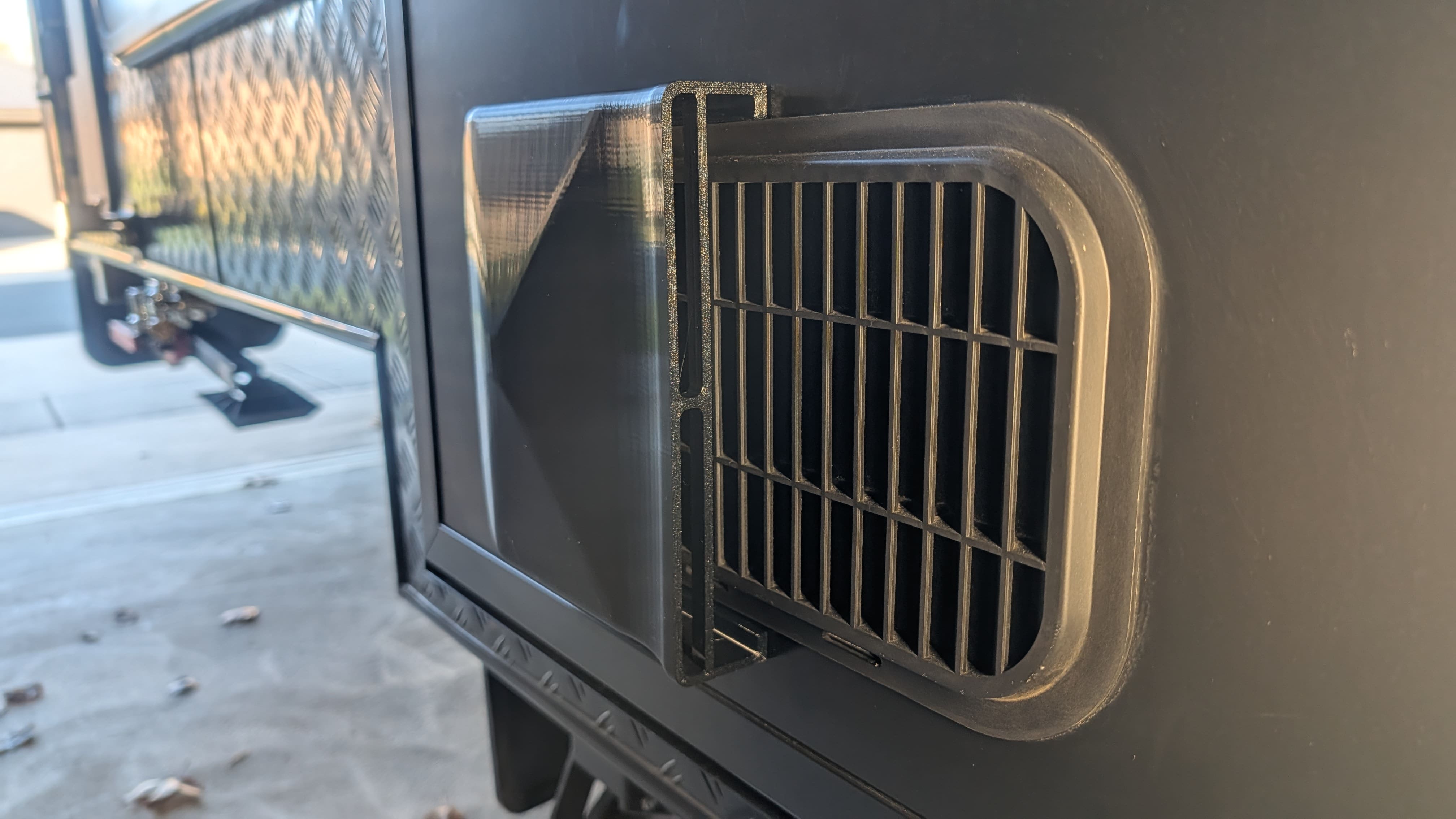 Peel-and-stick caravan vent door cover with pre-applied double-sided tape — no drilling required
