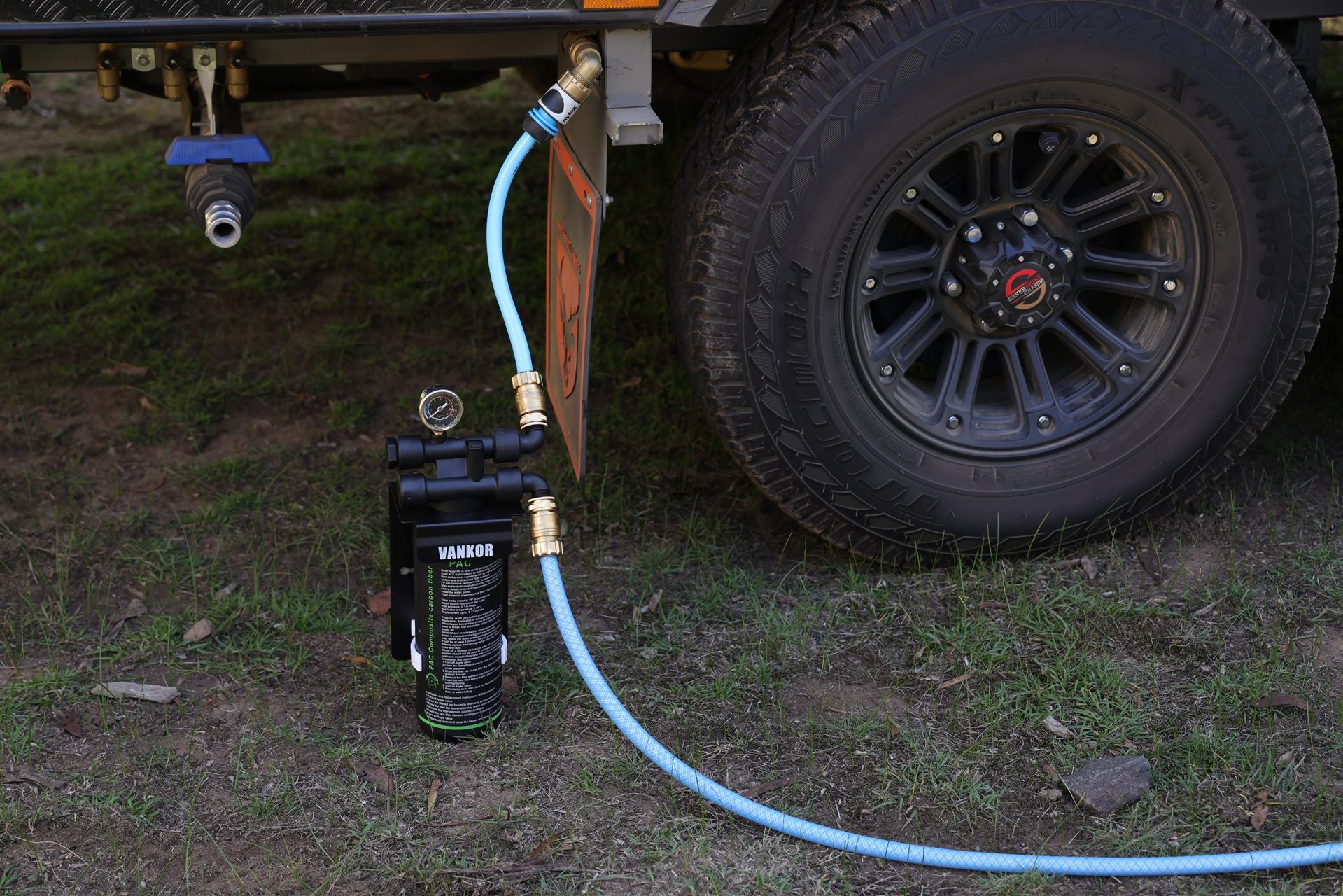 water filter connected to hose to caravan.